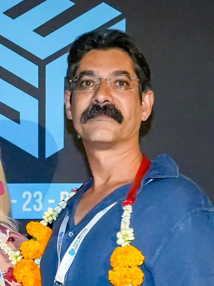 Nikhil Bakaya at GEM Bangkok, November 2025, with his GEM Pet Network badge.